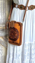 Load image into Gallery viewer, Side view of genuine leather hand tooled Mandala phone wallet crossbody with adjustable leather strap.