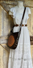 Load image into Gallery viewer, Model wearing the Boho Rustic Soul Mandala Leather Crossbody Bag featuring handcrafted mandala leather artwork, soft genuine leather and an adjustable crossbody strap. Designed in Australia by Dreamtime Boho.