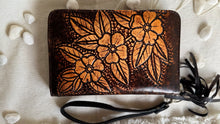Load image into Gallery viewer, Close view of the floral hand tooled design on the back of the leather boho wallet