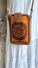 Load image into Gallery viewer, Close up of the intricate hand tooled Mandala design on a genuine leather phone wallet crossbody.