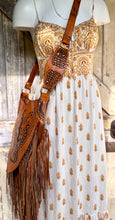 Load image into Gallery viewer, Rock angel wing guitar leather fringe bag worn crossbody with boho dress lifestyle view.
