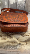 Load image into Gallery viewer, Base view of tan hand tooled leather boho crossbody bag showing structured shape and artisan leather detail