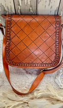 Load image into Gallery viewer, Back view of tan genuine leather crossbody bag showing hand tooled diamond pattern and adjustable shoulder strap