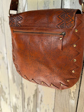 Load image into Gallery viewer, Rear view of antique studded hand tooled leather crossbody bag showing back zip pocket