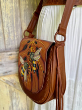 Load image into Gallery viewer, Bee Story leather boho crossbody bag worn on model with adjustable strap and tassel detail