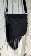 Load image into Gallery viewer, Black leather fringe crossbody bag showing large rear zip pocket and genuine leather finish