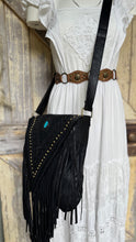 Load image into Gallery viewer, Black leather fringe crossbody bag styled on model with turquoise stone and long fringe