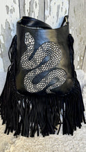 Load image into Gallery viewer, Close-up of handpainted snake artwork on black genuine leather boho fringe crossbody bag with western-inspired style.