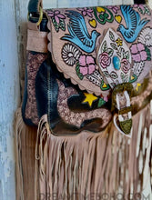 Load image into Gallery viewer, Close up of hand painted Love Story artwork on black leather fringe boho bag.