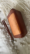 Load image into Gallery viewer, Top view of Boheme hand tooled leather wallet showing tan leather, dark brown woven edging and zip-around design by Dreamtime Boho 