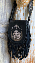 Load image into Gallery viewer, Bohemian black leather fringe bag with hand tooled lotus, moon phase artwork and flowing fringe