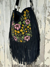 Load image into Gallery viewer, Boho Beauty black suede fringe shoulder bag angled view showing hand-painted floral detailing and soft suede texture