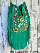 Load image into Gallery viewer, Side view of Boho Beauty green suede leather fringe crossbody bag, hand painted floral design by Dreamtime Boho