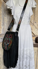 Load image into Gallery viewer, Boho crossbody bag with detailed hand painted leather strap, floral artwork and black fringe