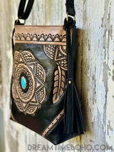 Load image into Gallery viewer, Side view of boho leather crossbody bag with hand tooled mandala design and turquoise stone.