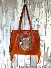 Load image into Gallery viewer, Front view of luxe hand tooled leather fringe boho tote shoulder bag with artisan detailing, designed in Australia by Dreamtime Boho
