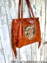 Load image into Gallery viewer, Close-up detail of hand tooled leather fringe and tassel on luxe boho tote bag by Dreamtime Boho, designed in Australia