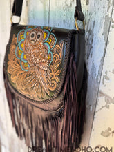 Load image into Gallery viewer, Boho owl leather fringe crossbody bag shown at an angle highlighting hand tooled and painted details
