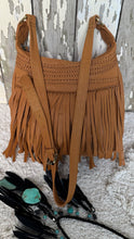 Load image into Gallery viewer, Angled view of tan Brooklyn small leather fringe crossbody bag with soft flowing fringe and woven accents