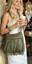 Load image into Gallery viewer, Olive green Brooklyn small leather fringe crossbody boho bag with woven detailing and long fringe worn by model – Dreamtime Boho