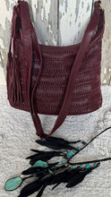 Load image into Gallery viewer, Burgundy leather boho crossbody bag with turquoise feather accessory and woven leather detailing.