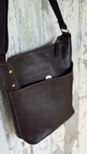 Load image into Gallery viewer, Rear view of chocolate brown leather crossbody handbag featuring a large magnetic pouch pocket for convenient everyday storage.