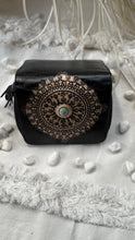 Load image into Gallery viewer, Compact black tooled leather wallet featuring intricate mandala artwork and turquoise stone detail