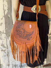 Load image into Gallery viewer, Front view of hand tooled crystal moon leather fringe crossbody bag in tan genuine leather with gemstone detail