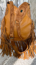 Load image into Gallery viewer, Rear view of the tan leather boho crossbody bag featuring hand tooled strap, soft genuine leather and double fringe.