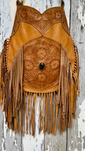 Load image into Gallery viewer, Close up of the hand tooled floral leather detailing and natural gemstone on the Desert Bloom boho fringe bag.