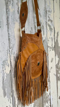 Load image into Gallery viewer, Side profile of the Desert Bloom genuine leather crossbody bag with flowing double layer fringe and hand tooled details.