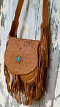 Load image into Gallery viewer, Angled view of the Desert Willow hand tooled tan leather boho crossbody bag with turquoise gemstone and artisan leather craftsmanship.