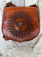 Load image into Gallery viewer, Side view of Desert Wings hand tooled leather crossbody bag featuring detailed mandala tooling and genuine leather construction