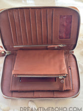 Load image into Gallery viewer, Open hand tooled leather wallet showing spacious interior, card slots, compartments and zippered coin pocket