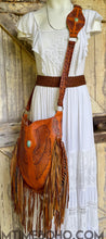 Load image into Gallery viewer, Angel Wings Hand Tooled Fringe Leather Boho Bag worn by model designed in Australia by Dreamtime Boho, artisan leather crossbody bag, shipping worldwide from Queensland Australia