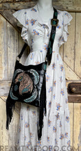 Load image into Gallery viewer, Dreamtime Boho hand painted black Love Story leather fringe boho crossbody bag, worn on model. Worldwide shipping from Queensland Australia.