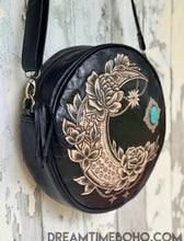 Load image into Gallery viewer, Rustic Moon round leather crossbody boho bag featuring hand tooled moon artwork, designed in Australia by Dreamtime Boho