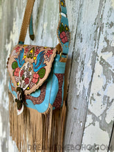 Load image into Gallery viewer, Dreamtime Boho turquoise Love Story hand painted leather fringe crossbody bag side view. Worldwide shipping from Queensland Australia.
