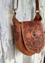 Load image into Gallery viewer, Floral Spirit hand tooled leather boho crossbody bag in tan with detailed floral carving and oval natural stone on flap.