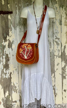 Load image into Gallery viewer, Groovy Mushroom leather crossbody bag shown worn with adjustable shoulder strap