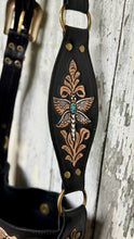 Load image into Gallery viewer,     Hand tooled leather crossbody strap featuring intricate dragonfly artwork and turquoise gemstone accent.