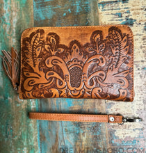 Load image into Gallery viewer, Hand tooled genuine leather boho wallet in rustic tan with floral detailing and detachable wristlet strap.