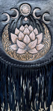 Load image into Gallery viewer, Close up of hand tooled lotus artwork and braided edging on black leather boho fringe bag