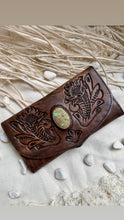 Load image into Gallery viewer, Handcrafted leather boho wallet and purse with floral detailing and natural gemstone feature, angled view
