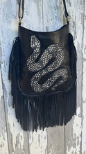 Load image into Gallery viewer, Handpainted black leather snake fringe boho crossbody bag with long flowing fringe and adjustable strap by Dreamtime Boho.