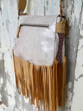 Load image into Gallery viewer, Rear view of hibiscus leather fringe crossbody bag with distressed off white leather and zip pocket
