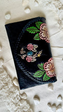 Load image into Gallery viewer, Black boho leather wallet purse with hand tooled and hand painted hibiscus floral detailing and turquoise centre accent