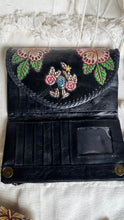 Load image into Gallery viewer, Black genuine leather wallet open showing card slots, ID window, hand painted floral flap and magnetic closure