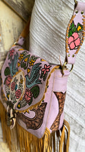 Load image into Gallery viewer, Side view of Lilac Love Story genuine leather boho bag featuring hand painted artwork and long leather fringe.