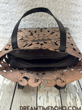 Load image into Gallery viewer, Top view of antique black hand tooled lotus leather tote bag showing opening and craftsmanship details